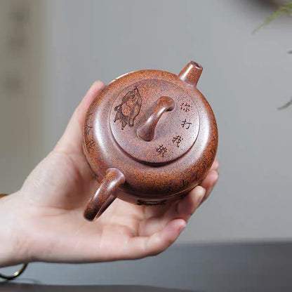 Carving Nezha Handuo Pot in the Clay of Yixing Zisha Pot Raw Mine by Hand-burning.