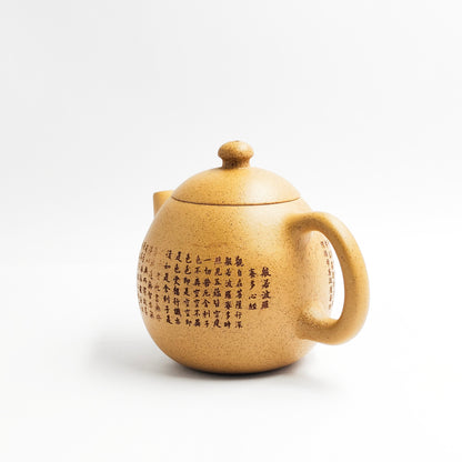 Master Xiang Jian handcrafted the yellow clay carving dragon egg teapot.