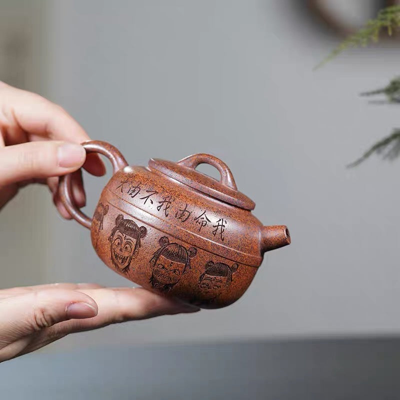 Carving Nezha Handuo Pot in the Clay of Yixing Zisha Pot Raw Mine by Hand-burning.