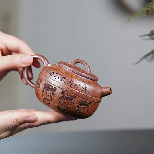 Carving Nezha Handuo Pot in the Clay of Yixing Zisha Pot Raw Mine by Hand-burning.