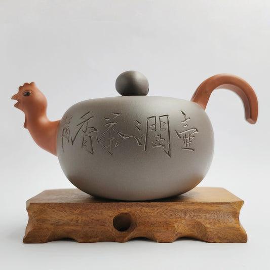 Master Yin Jiaji handcrafted the purple mud teapot for the Year of the Rooster.