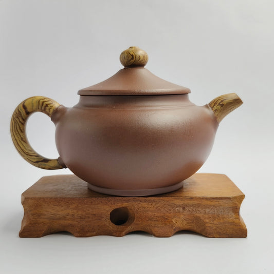 Master Yin Jiaji handmade purple mud hat teapot.